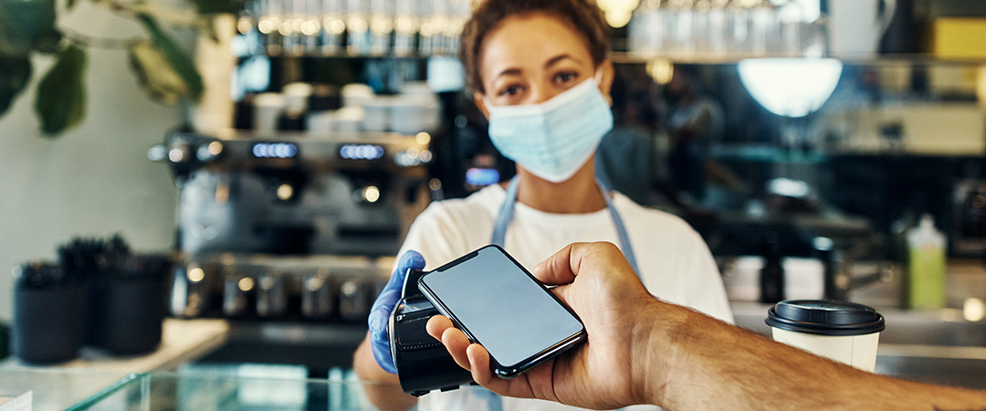 business owner accepting touchless payment