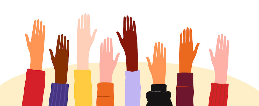 An illustration of raised hands in a multitude of colors