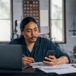 Diverse small business owner preparing a loan application